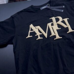 AMIRI Black Tee with Large Gold Logo